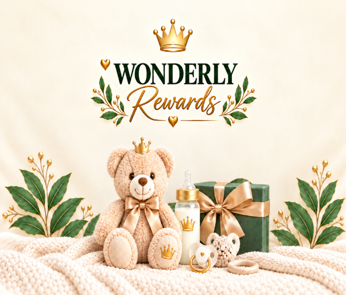A promotional graphic with the words 'WONDERLY Rewards' at the top, decorated with gold crown and heart motifs, leaves, and a soft cream background. At the bottom, a teddy bear wearing a gold bow and crown sits beside a baby bottle, pacifier, and green gift box with a gold ribbon.